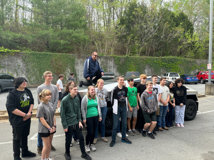 AFJROTC cadets with a Tesla cybertruck